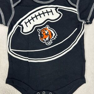 NFL Cincinnati Bengals, Black and Orange Football Graphic baby 12 month onesie.
